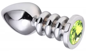 Серебристая анальная пробка на рельефной ножке с салатовым кристаллом - 9 см.